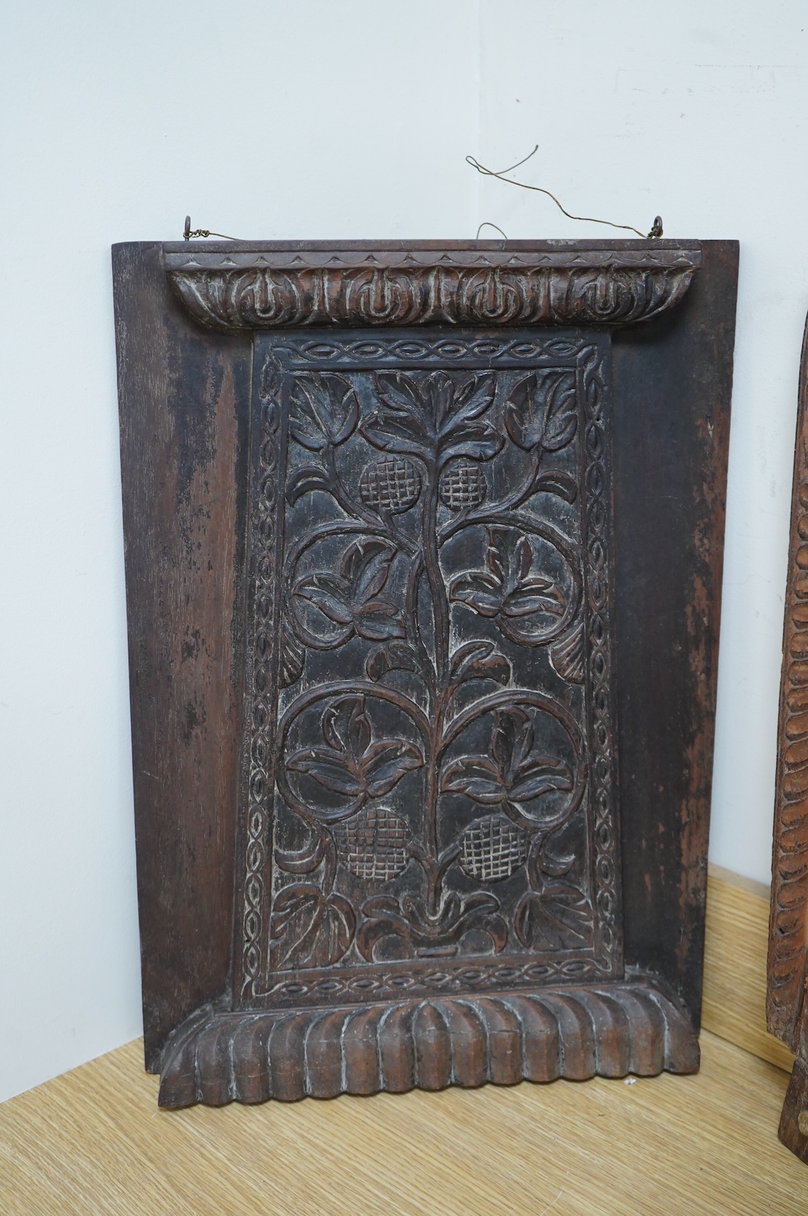 An Anglo-Indian carved wood crest and a similar door portico, latter 127cm in length